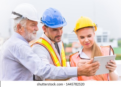 group of builder engineer and architecture using new technology of tablet for inspect building design working join together