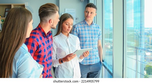 Group Of Buisness People Working On Tablet