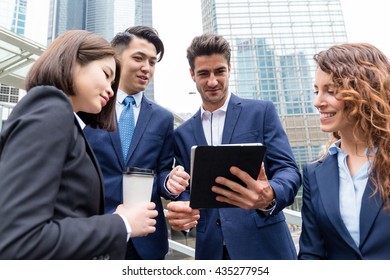 Group Of Buisness People Working On Tablet 