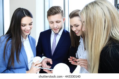 Group Of Buisness People Working On Tablet 