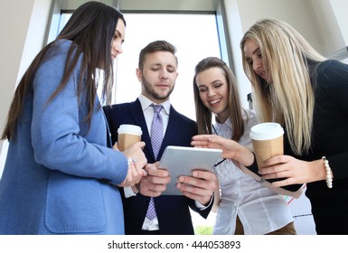 Group Of Buisness People Working On Tablet 