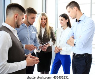 Group Of Buisness People Working On Tablet