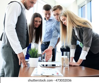 Group Of Buisness People Working On Tablet