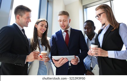 Group Of Buisness People Working On Tablet