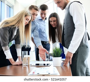 Group Of Buisness People Working On Tablet