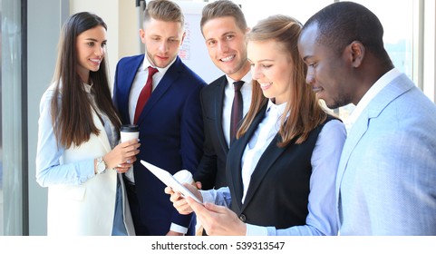 Group Of Buisness People Working On Tablet 