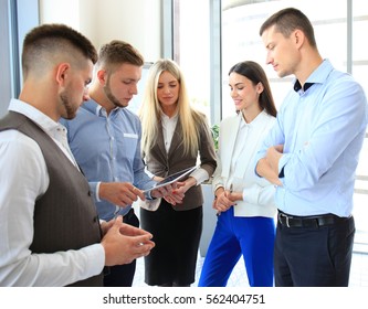 Group Of Buisness People Working On Tablet