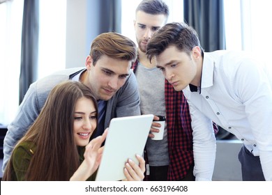 Group Of Buisness People Working On Tablet.