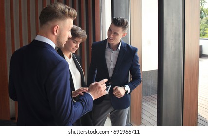 Group Of Buisness People Working On Tablet.