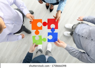 Group Businees People Hold Color Element Puzzle Top View Background Closeup. Each Fulfills Its Task Division Of Labor Concept