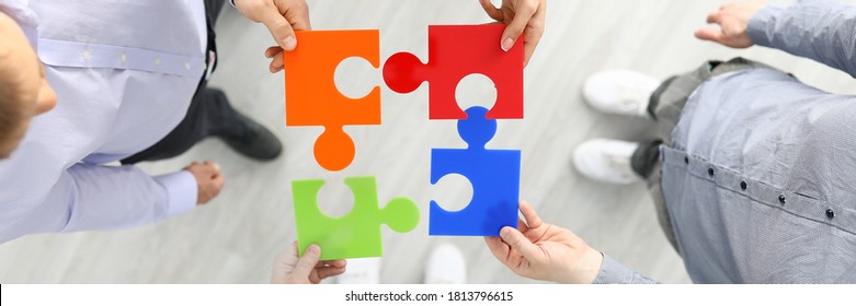 Group Businees People Hold Color Element Puzzle Top View Background Closeup. Each Fulfills Its Task Division Of Labor Concept