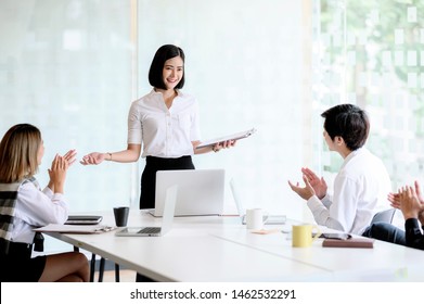 Group Of Business Asian People Hands Clapping After Businesswoman Presenting,Success Presentation And Coaching Seminar At Office