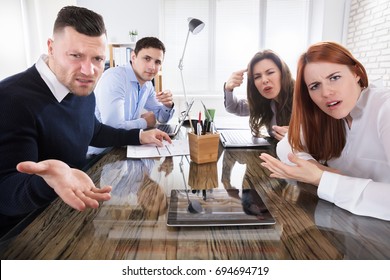 Group Of Business Executives Complaining Toward Camera In Office - Shutterstock ID 694694719