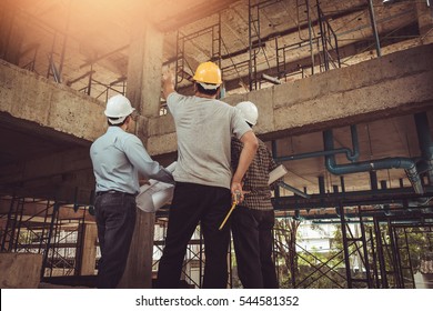 Group business man construction site engineer, effect Vintage sun flare. - Powered by Shutterstock