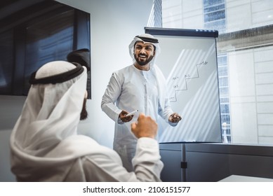 Group of business managers from the emirates meeting and working together in Dubai. Arabian businessmen wearing traditional clothes