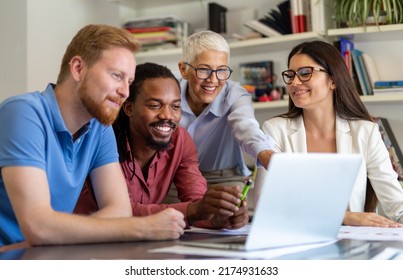 Group of business partners discussing documents and ideas at meeting in corporate office - Shutterstock ID 2174931633