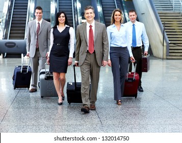 Group Of Business People In Airport. Travel Background.