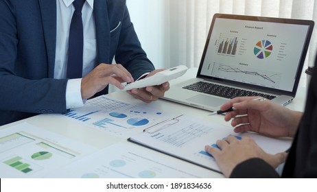 Group of business people analysis summary graph reports of business operating expenses and work data about the company's financial statements.