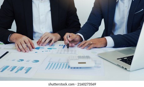 Group of business people analysis summary graph reports of business operating expenses and work data about the company's financial statements. - Shutterstock ID 2160273569