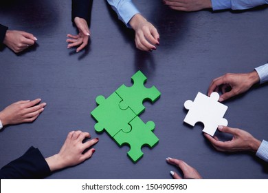 Group Of Business People Assembling Jigsaw Puzzle, Team Support Problem Solution And Help Concept