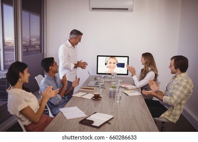 Group of business people attending video conference in office - Powered by Shutterstock