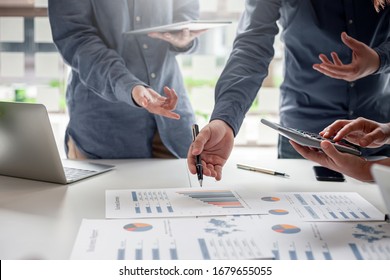 Group of business people brainstorming, analyzing and planning to work together at the meeting. - Shutterstock ID 1679655055
