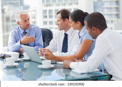 Group of business people brainstorming together in the meeting room - Powered by Shutterstock