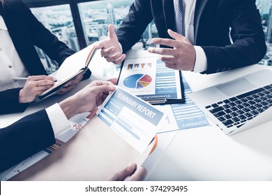 Group Of Business People Busy Discussing Financial Matter During Meeting