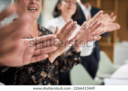 Group of business people clapping and giving applause with hands in office