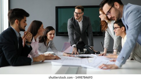 Group Of Business People Collaborating In Office