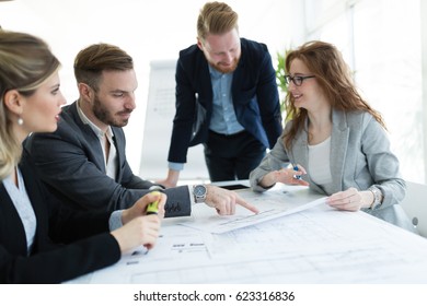 Group of business people collaborating on project  in office - Shutterstock ID 623316836