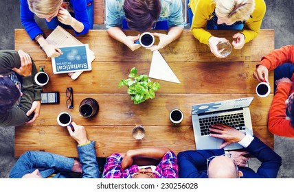 Group of Business People Discussing on a Cafe