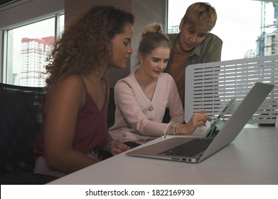 Group Of Business People With Diverse Genders (LGBT) Discuss Business In The Meeting Room At Office Workplace