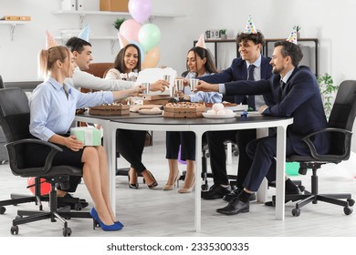 Group of business people drinking at birthday party in office - Powered by Shutterstock