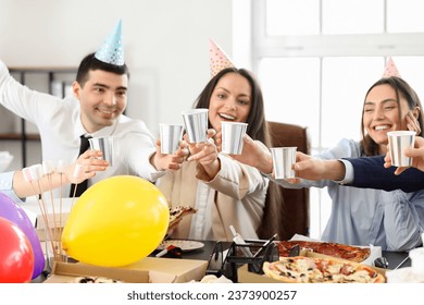 Group of business people drinking at birthday party in office - Powered by Shutterstock