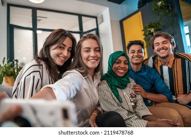 Group Of Business People During Break From The Work Taking Selfie Picture While Enjoying Free Time In Relaxation Area At Modern Open Plan Startup Office. Selective Focus 