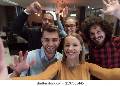 Group Of Business People During Break From The Work Taking Selfie Picture While Enjoying Free Time In Relaxation Area At Modern Open Plan Startup Office. Selective Focus 