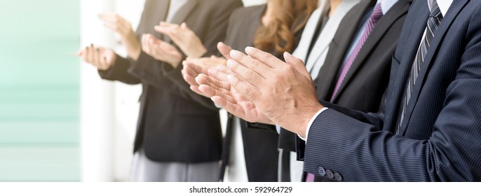 Group of business people giving an applause in the meeting, panoramic banner - Shutterstock ID 592964729