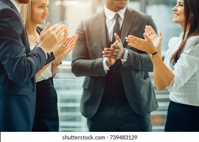 Group of business people giving an applause in the meeting - Shutterstock ID 739483129