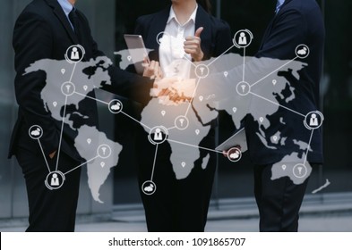 group of business people handshake and showing thumbs up after finishing up business meeting and icon world map network connection diagram, technology, internet, investment, global business concept