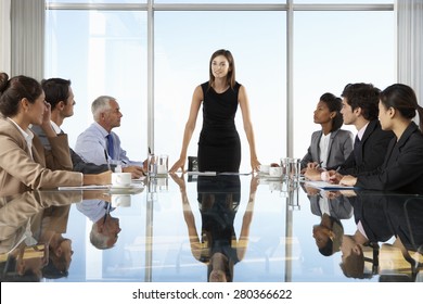 Group Of Business People Having Board Meeting Around Glass Table - Shutterstock ID 280366622