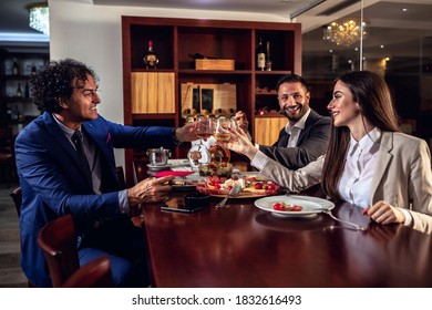 Group Of Business People Having Dinner On A Calm And Peaceful Night
