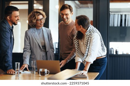 Group of business people having a meeting in a tech company. Creative business professionals planning a project in an office. Teamwork and collaboration in a modern workplace.