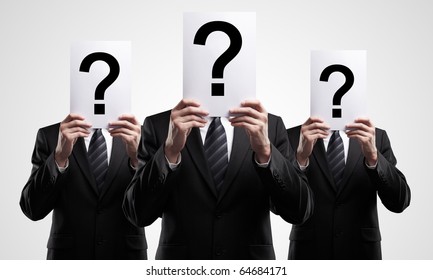 Group Of Business People Holding A Question Mark