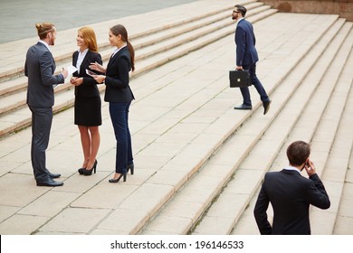 Group Of Business People Interacting Outside