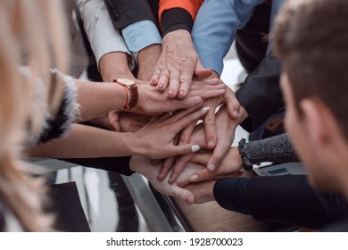 Group Of Business People Joining Hand Together For Making A Deal