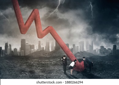 Group Of Business People Looking At Declining Arrow Breaking Through The Ground With Cloudy Sky Background