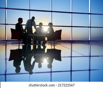 Group Of Business People Meeting In Back Lit