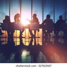 Group Of Business People Meeting Back Lit Concept