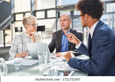 Group Of Business People In A Meeting Discussing And Planning A Project